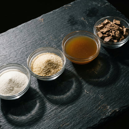 Bowls of the four LongTails ingredients: two powders, beef bone broth and beef liver pieces
